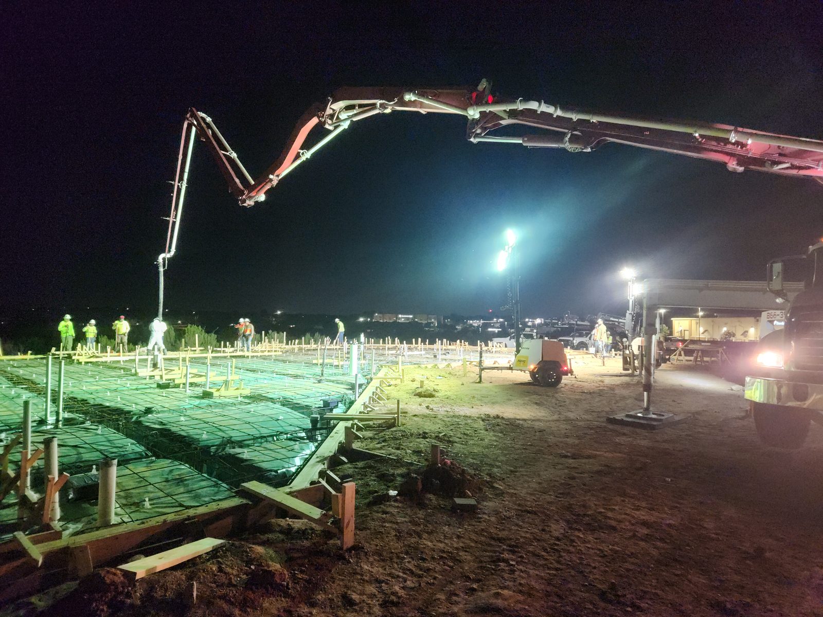 Night concrete pour and sitework